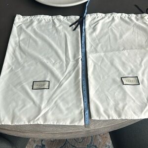 Two Gucci dust bags 24” x 13”